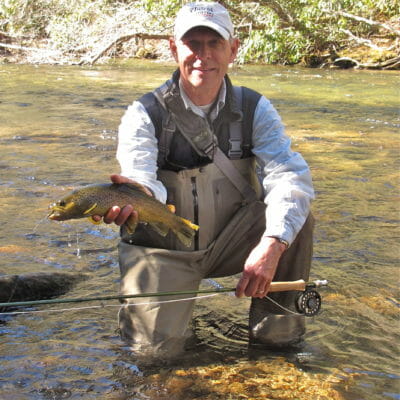 Outfitter Jimmy Harris poses with a nice trout.