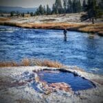 An angler fishes the Firehole River in Yellowstone National Park.