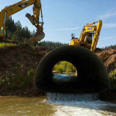 Culvert under construction with heavy equipment